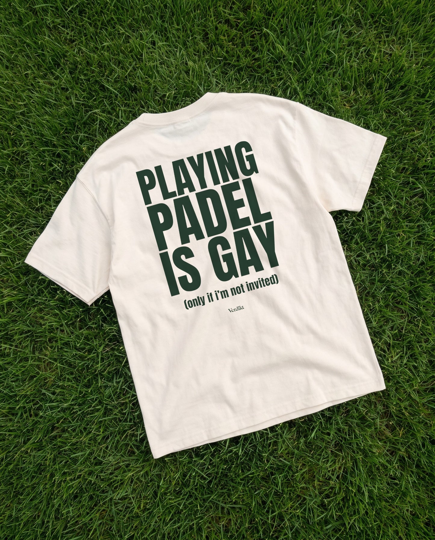 PLAYING PADEL IS GAY print - tee laid on grass
