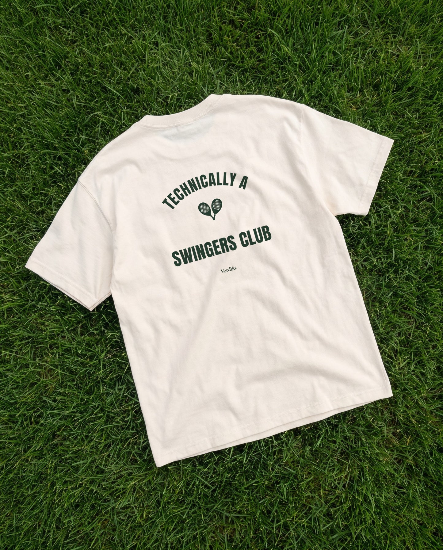 TECHNICALLY A SWINGERS CLUB print - tee laid on grass