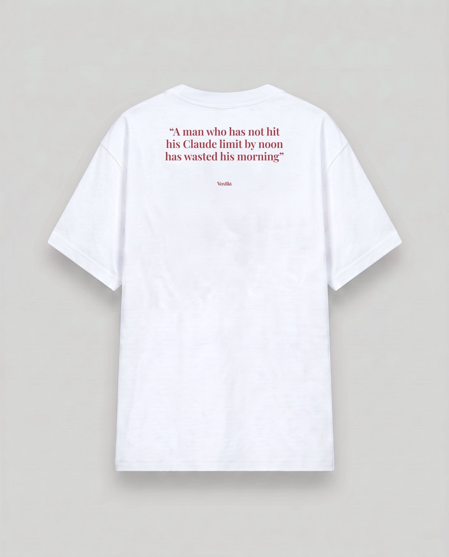 A man who has not hit his Claude limit by noon has wasted his morning - quote print - cloud white tee, back (grey studio)