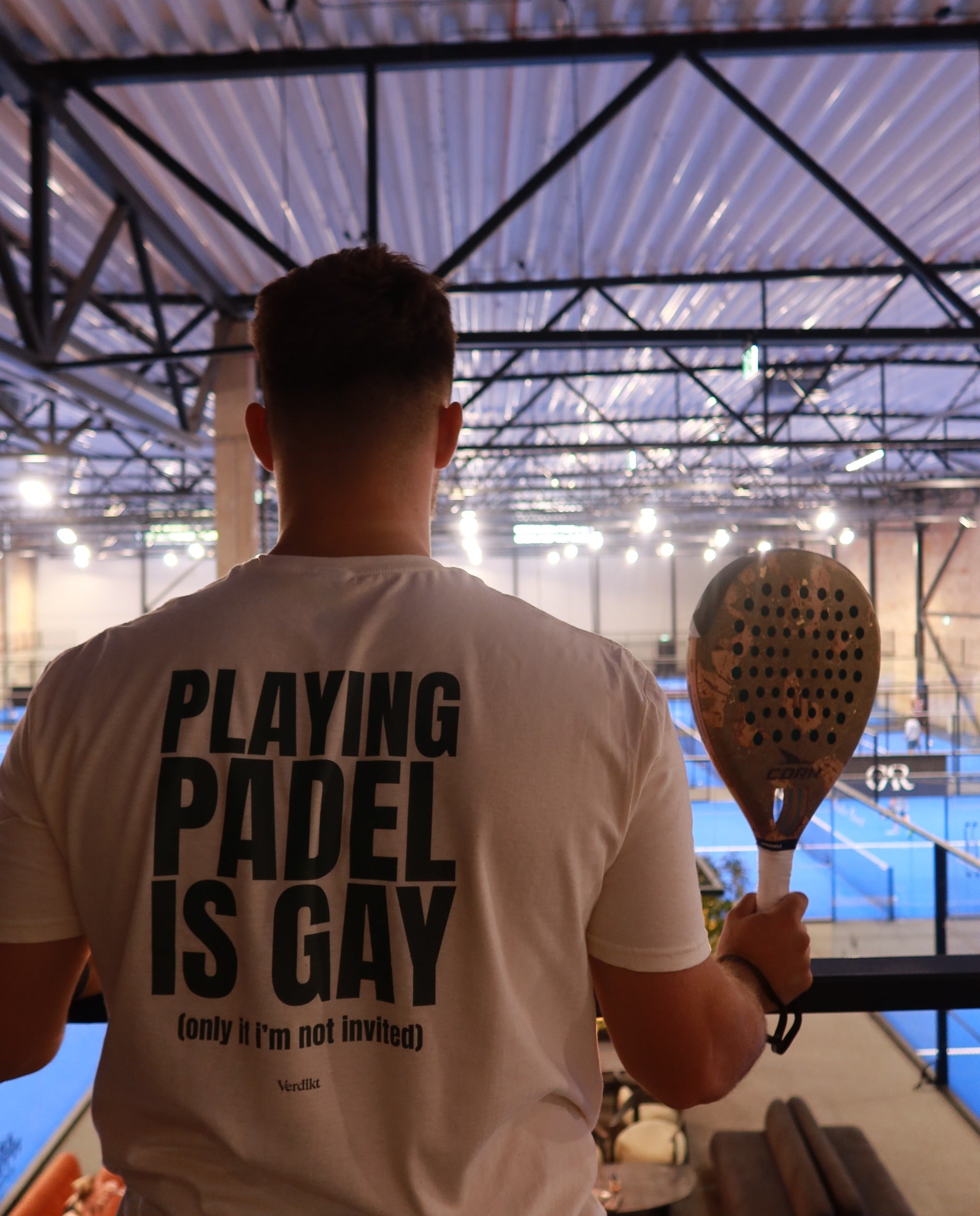 PLAYING PADEL IS GAY print - worn at the padel court, racket in hand