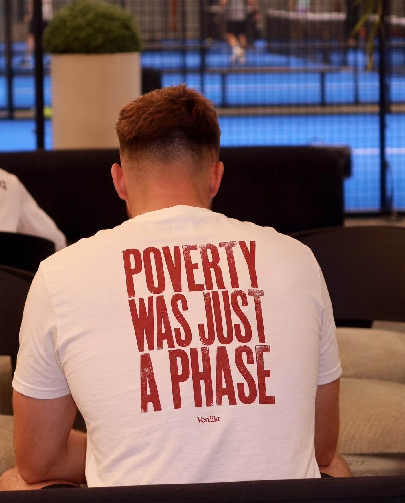 POVERTY WAS JUST A PHASE red print - worn, lounge sofa